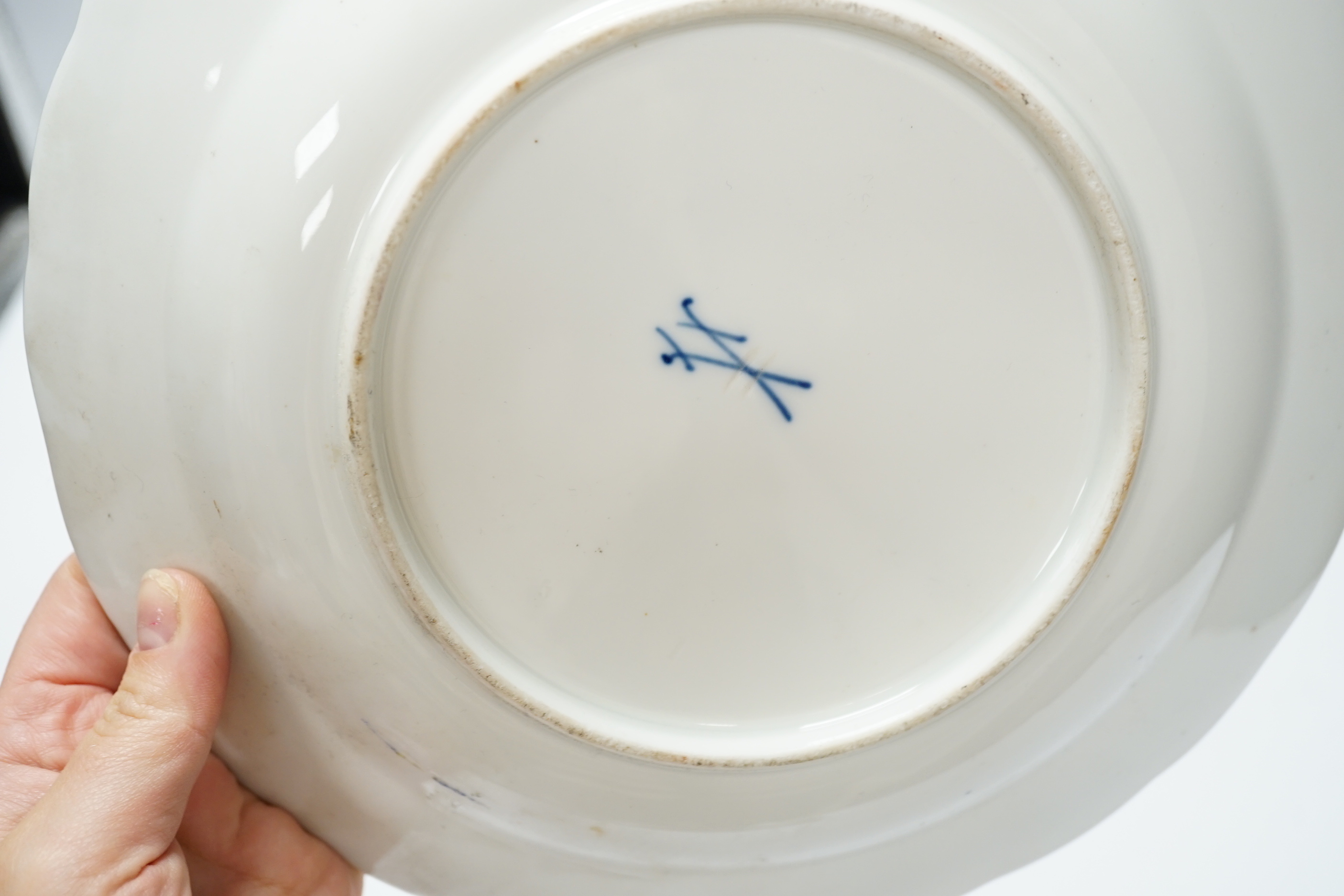 Three Meissen outside figurative and floral decorated plates, 23.5cm diameter